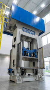 Compression molding press by Macrodyne Technologies.