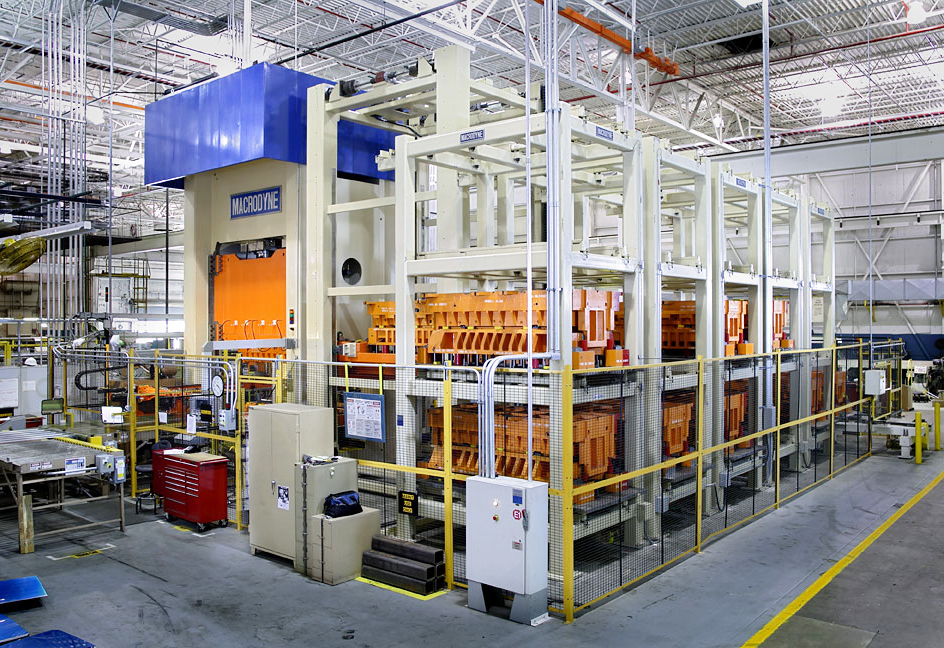 Automated press by Macrodyne.