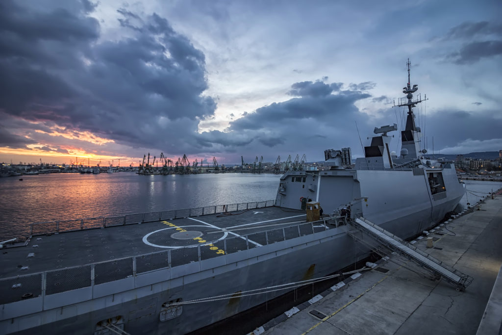 Naval ship at sunset.